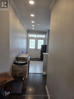 Thorold (Hurricane/Merrittville) apartment for rent - A long hallway with a U haul box on the floor.