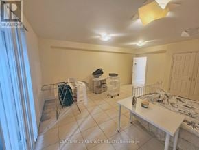 Toronto (Newtonbrook East) apartment for rent - A room with a table, chairs, and a bed in it.