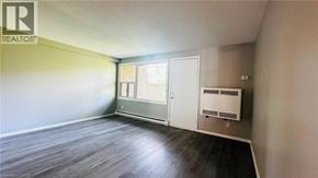 Kitchener townhouse for rent - A room with a REALTOR sign on the wall.