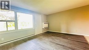 Kitchener townhouse for rent - A room with a window and a door is available for rent.