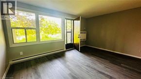 Kitchener townhouse for rent - A room with a window and a door is shown.