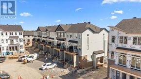 Ottawa townhouse for rent - A construction site with a white van and a car parked in front of a building under construction.