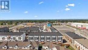 Ottawa townhouse for rent - A real estate company logo is superimposed on an aerial view of a residential area.
