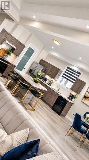 Niagara Falls (Forestview) apartment for rent - A modern kitchen with a dining area and a living room.