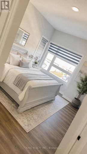 Niagara Falls (Forestview) apartment for rent - A bedroom with a large bed and a window with blinds.