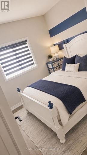Niagara Falls (Forestview) apartment for rent - A bedroom with a white bed and a blue blanket.