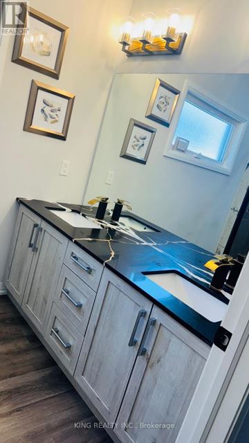 Niagara Falls (Forestview) apartment for rent - A kitchen with a counter top and cabinets.