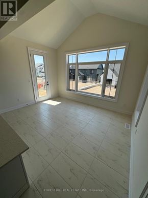 Oro-Medonte (Horseshoe Valley) apartment for rent - A room with a large window and a tiled floor.