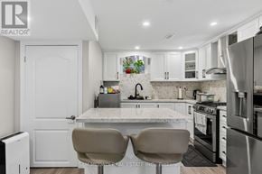 Milton (Cl Clarke) apartment for rent - A kitchen with a marble countertop and stainless steel appliances.