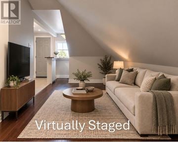 Toronto (Palmerston-Little Italy) apartment for rent - A living room with a couch, coffee table, and television.