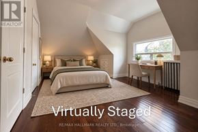 Toronto (Palmerston-Little Italy) apartment for rent - A bedroom with a bed, a chair, and a window.