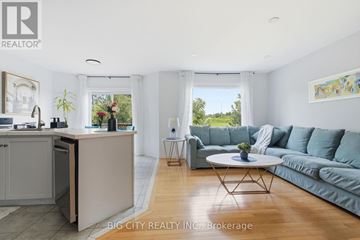 Mississauga (Meadowvale Village) apartment for rent - A living room with a grey couch and a white coffee table.