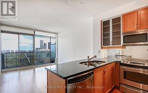 Toronto (Annex) condo for rent - A modern kitchen with wooden cabinets and stainless steel appliances.