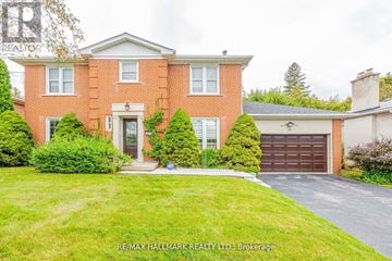 Toronto (Newtonbrook East) apartment for rent - A red brick house with a white garage door.