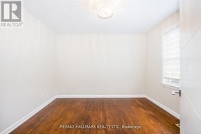 Toronto (Newtonbrook East) apartment for rent - A room with a wooden floor and white walls.