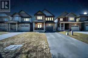 Centre Wellington (Fergus) apartment for rent - A nighttime view of a residential neighborhood with houses and a street.