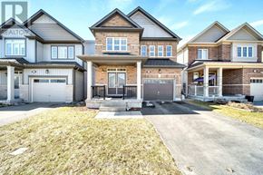 Centre Wellington (Fergus) apartment for rent - A row of houses with a realtor watermark.