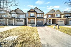 Centre Wellington (Fergus) apartment for rent - A row of houses with a driveway in front.