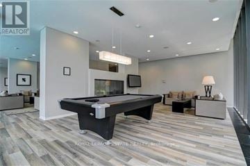 Toronto (Church-Yonge Corridor) condo for rent - A spacious living room with a pool table and a television.