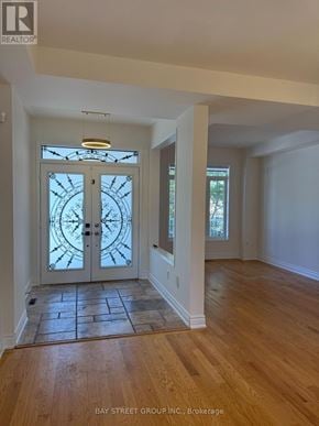 Markham (Berczy) apartment for rent - A glass door with a clock design on it.