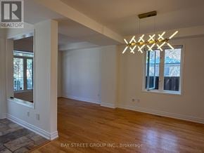 Markham (Berczy) apartment for rent - A room with wooden floors and a large window.