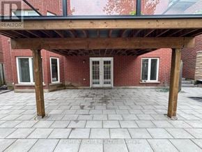 Vaughan (Patterson) apartment for rent - A patio with a wooden pergola and tiled floor.