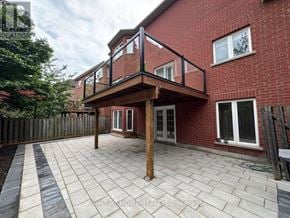 Vaughan (Patterson) apartment for rent - A red brick house with a patio and a deck.