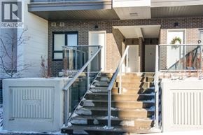 Kitchener condo for rent - A house with a staircase leading to the front door.
