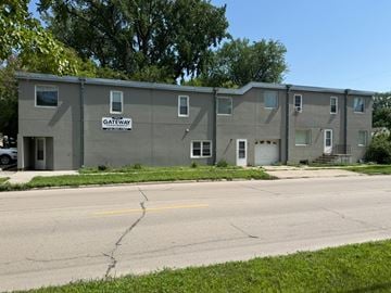 Grand Forks apartment for rent - A building with the word "Gateway" on the side is surrounded by trees.