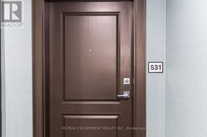 Hamilton (Waterdown) condo for rent - A brown door with the number 531 on the wall to the right.