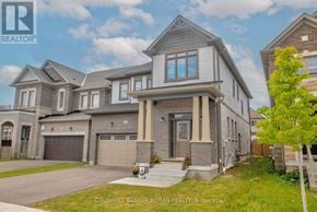New Tecumseth apartment for rent - A large, modern house with a grey and brown exterior and a large front yard.