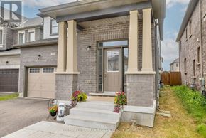 New Tecumseth apartment for rent - A house with a front porch and a garage door.