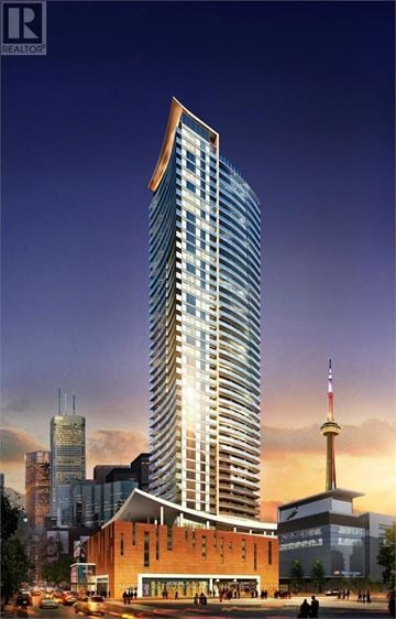 Toronto (Waterfront Communities) condo for rent - A tall building with a glass facade is the main focus of the image.