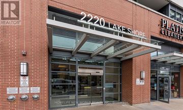 Toronto (Mimico) condo for rent - The front of a building with a sign that reads "2220 Lake Shore".