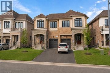 Milton apartment for rent - A large, multi-story house with a car parked in front.