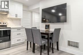 Milton apartment for rent - A modern kitchen with a dining table and chairs.