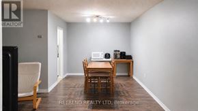 Toronto (Newtonbrook West) condo for rent - A room with a desk and chairs is shown in the image.
