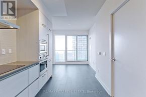 Toronto (Mount Pleasant West) condo for rent - A kitchen with white cabinets and a window.