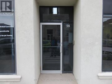 Fort Erie (Central) multi-family for rent - The door of a building with a sign that says REALTOR.