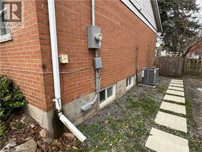 Cambridge apartment for rent - A brick house with a white pipe coming out of it.
