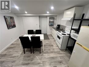 Cambridge apartment for rent - A kitchen with a table and chairs in the middle of the room.