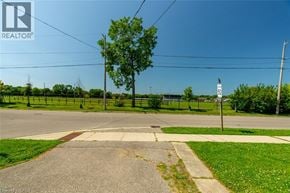 Milton apartment for rent - A realtor photo of a street corner with a sign.