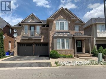 Milton (Be Beaty) apartment for rent - A large brick house with a black garage door is for sale.