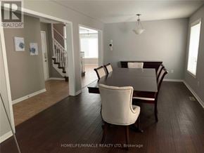 Milton (Be Beaty) apartment for rent - A living room with a white chair and a wooden table.