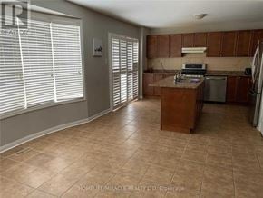 Milton (Be Beaty) apartment for rent - A kitchen with brown cabinets and a tile floor.