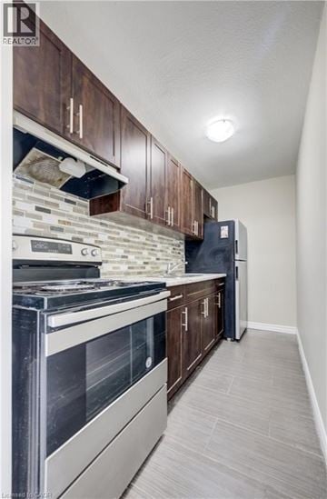 Waterloo apartment for rent - A kitchen with a stove top oven and a refrigerator.
