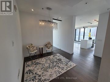 Toronto (Little Portugal) condo for rent - A living room with a rug and chairs.