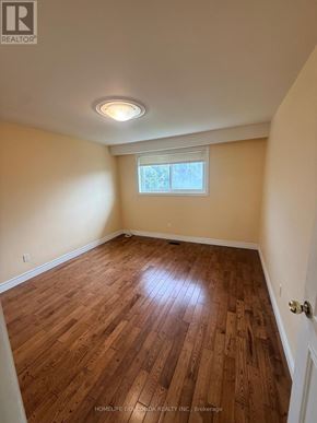 Toronto (Tam O'shanter-Sullivan) apartment for rent - A room with wooden flooring and a window.