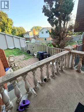 Toronto (Tam O'shanter-Sullivan) apartment for rent - A balcony with a purple scooter on it.