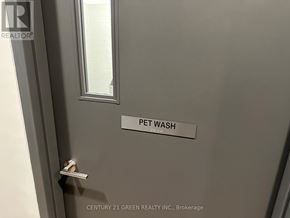 Kitchener condo for rent - A door with a label that says "PET WASH" on it.